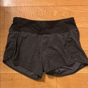 Black Athletic Shorts with Elastic Waistband and Curved Hem